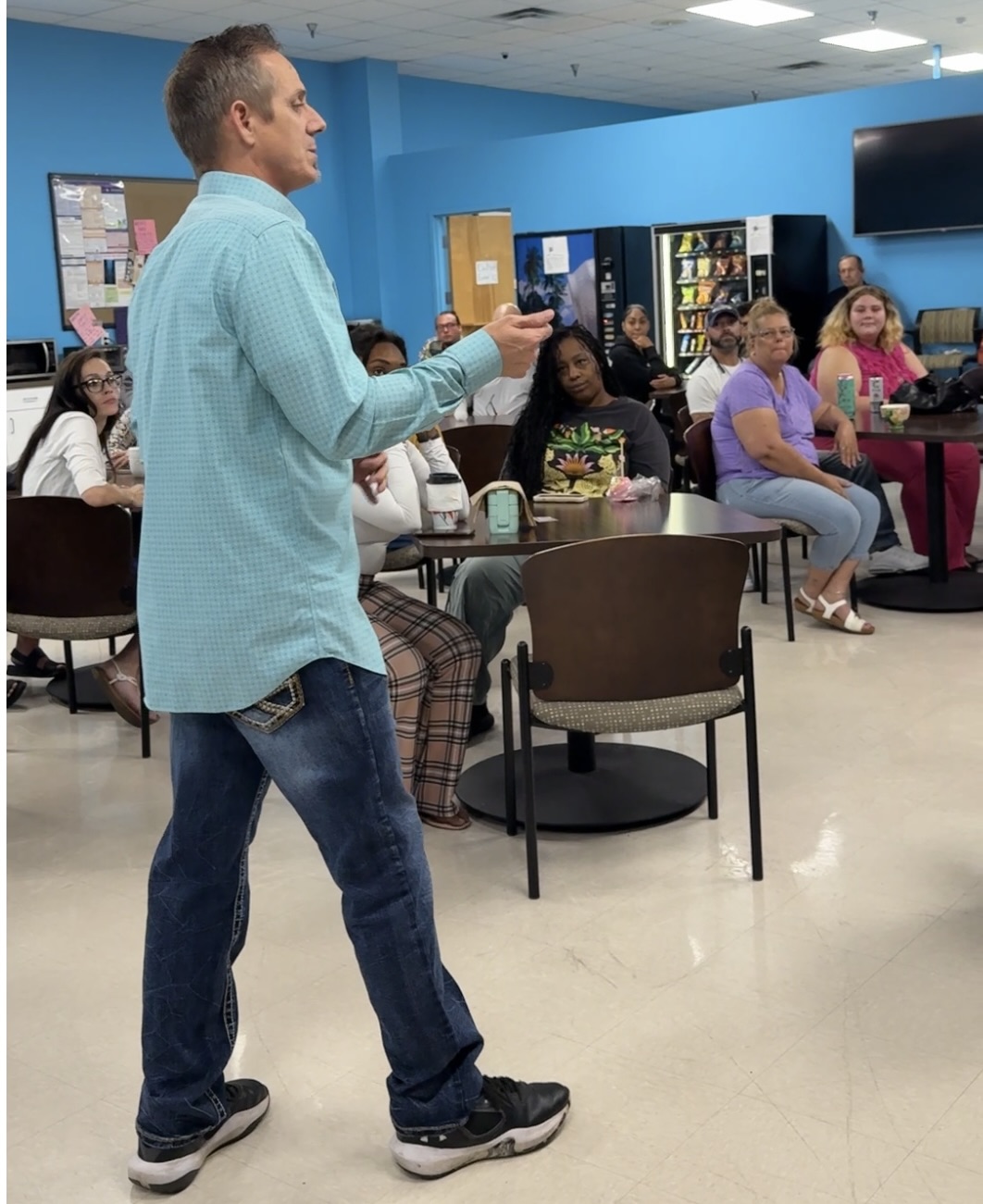 Jason Cremeans, founder of The Confidence Companies, speaking to a team